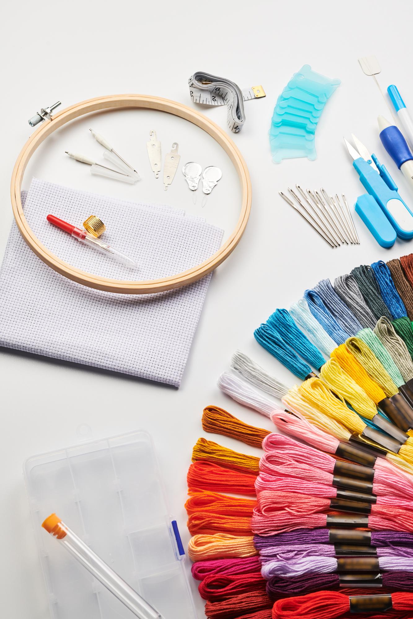 Array of embroidered samples laid on table